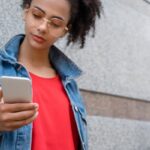 girl-looking-at-smartphone-screen